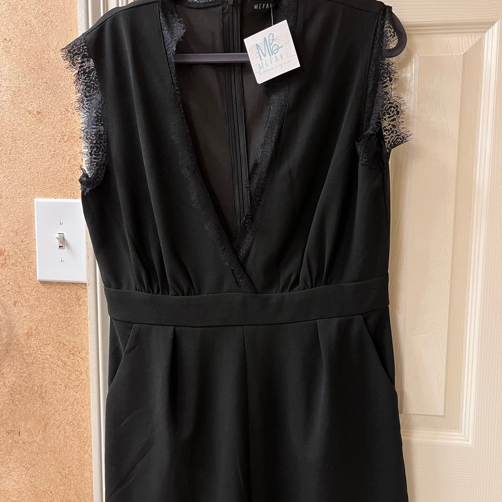 Boutique lace trimmed black shorts jumpsuit. Size L stretch black fabric New
